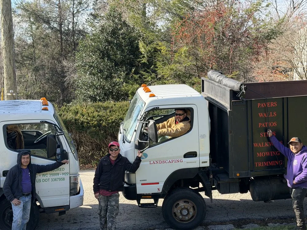 Baudi Landscaping crew beside the company box truck