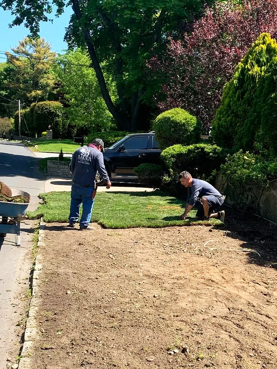 Baudi crew member on a landscaping job