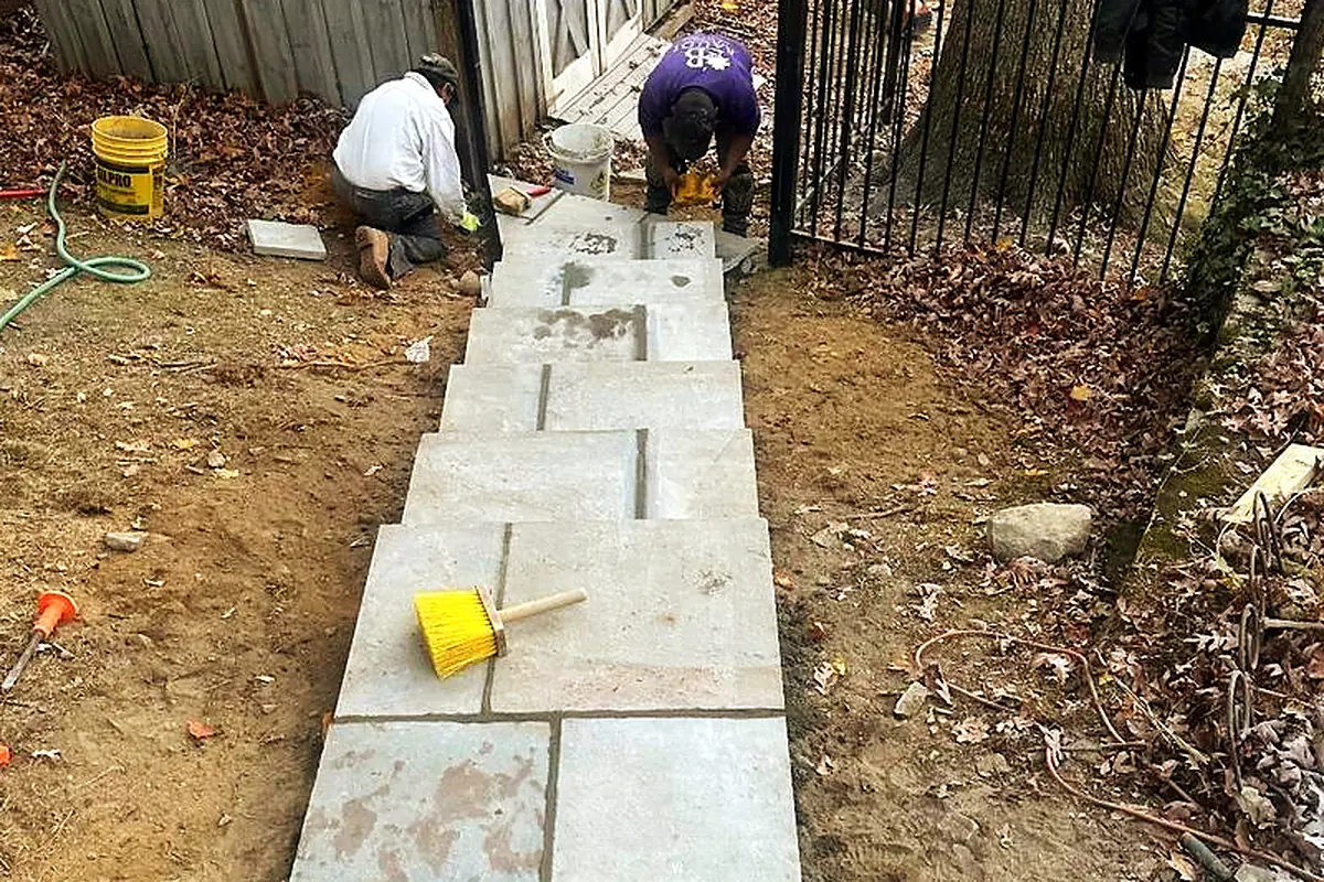 Stone walkway reset on a prepared base